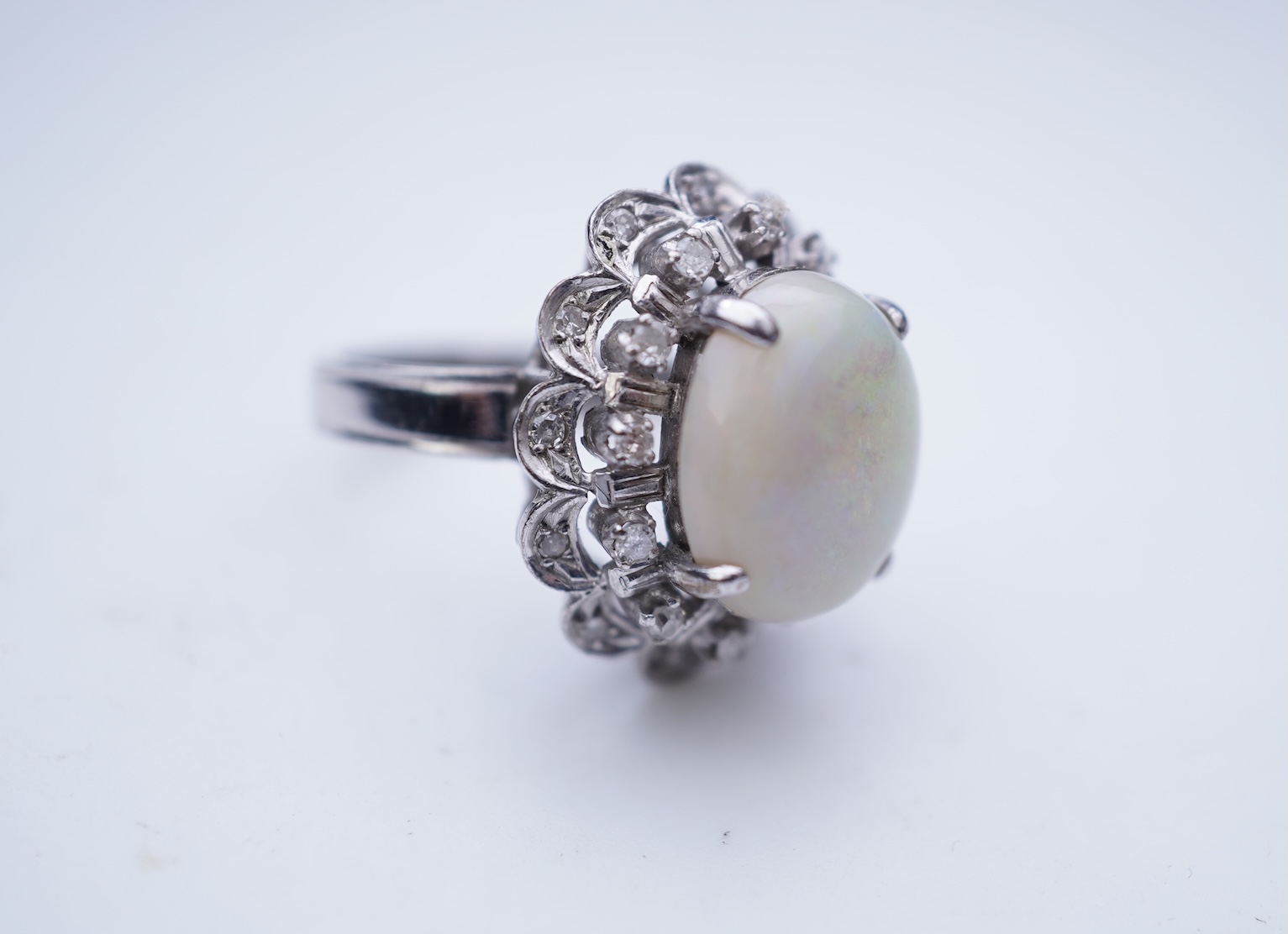 An opal and diamond cluster ring
